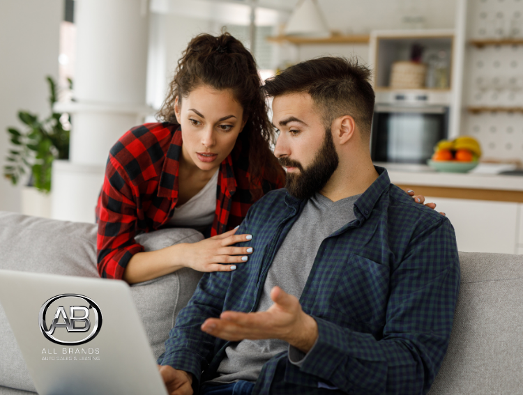 couple discussing finances about buying or leasing a car in new jersey